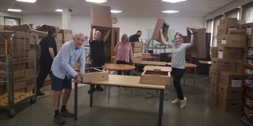 image of workers assembling food boxes